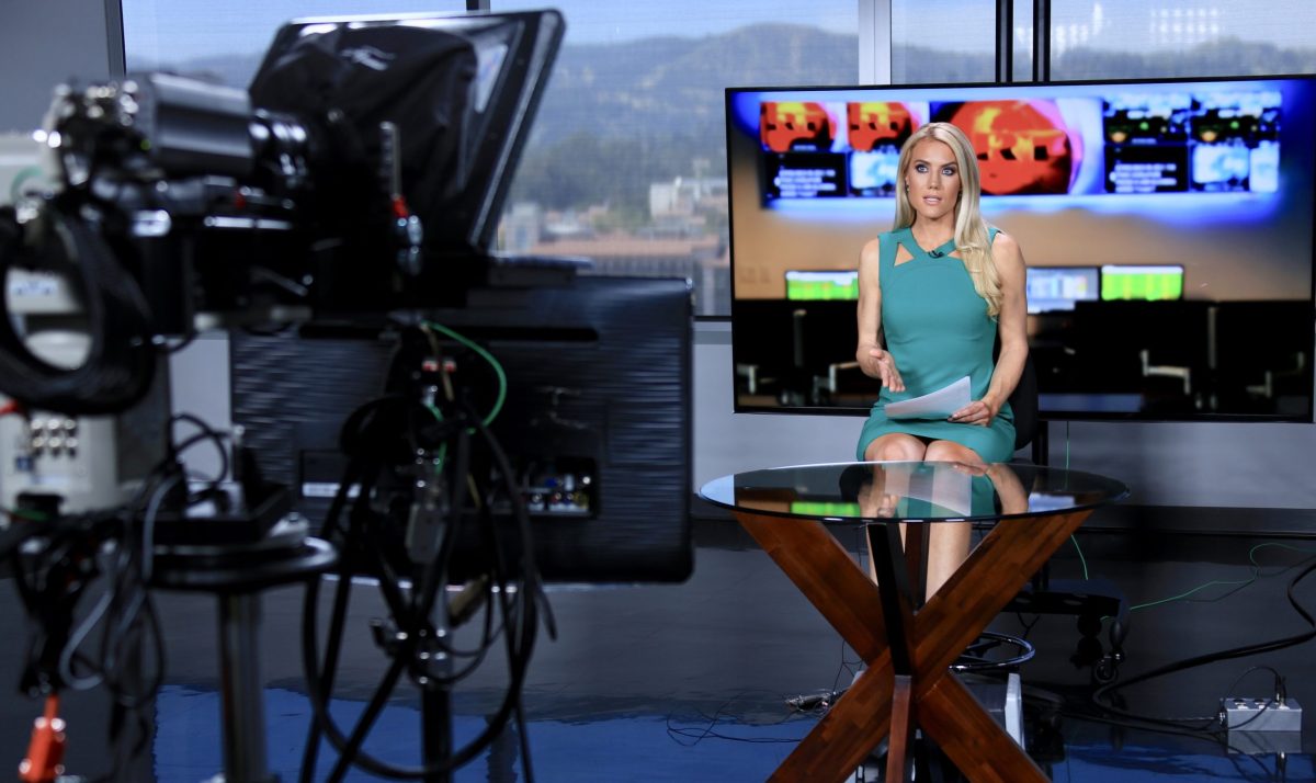 Natasha Sweatte at TV anchor desk